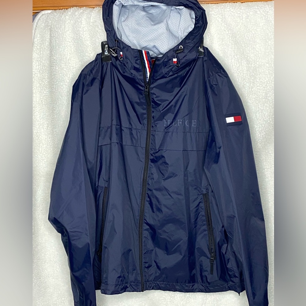 Here we have a Tommy Hilfiger windbreaker XL blue NEW never been worn